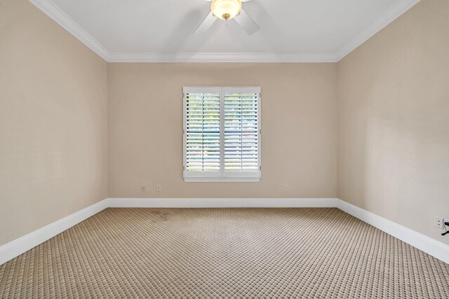 empty room featuring crown molding, a ceiling fan, baseboards, and light carpet