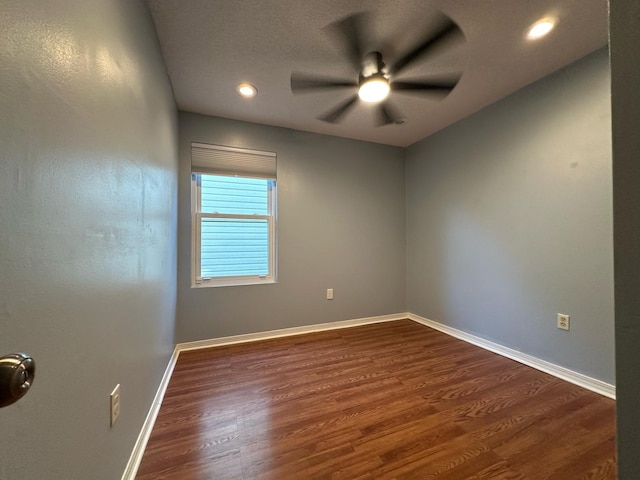 unfurnished room with recessed lighting, baseboards, dark wood-style flooring, and ceiling fan