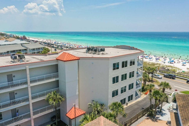 bird's eye view featuring a view of the beach and a water view