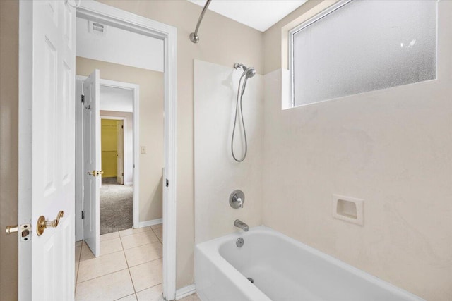 bathroom with tile patterned floors, shower / bath combination, baseboards, and visible vents