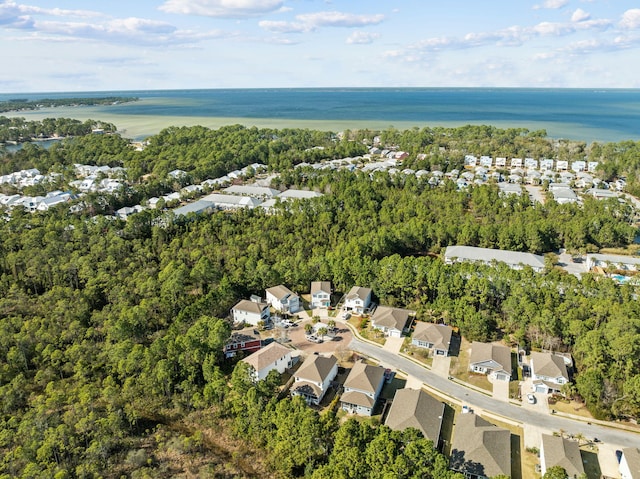 birds eye view of property with a residential view and a water view