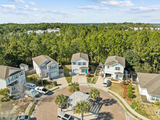 bird's eye view featuring a forest view and a residential view