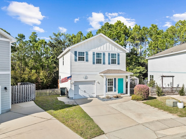 view of front of property with board and batten siding, concrete driveway, an attached garage, and fence