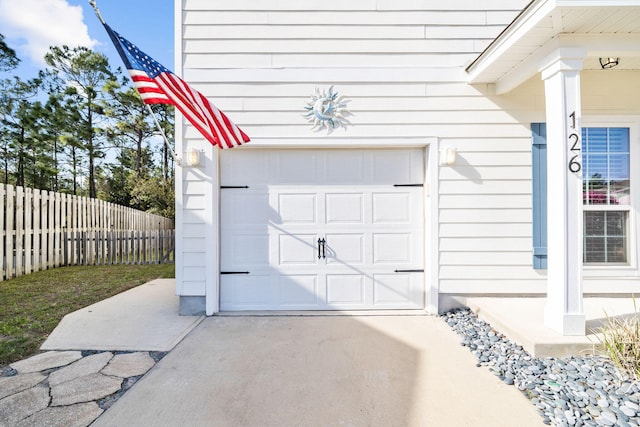 garage with fence