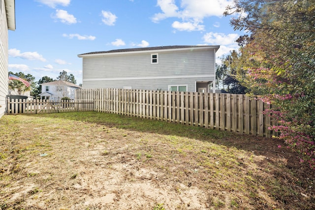 view of yard with a fenced backyard