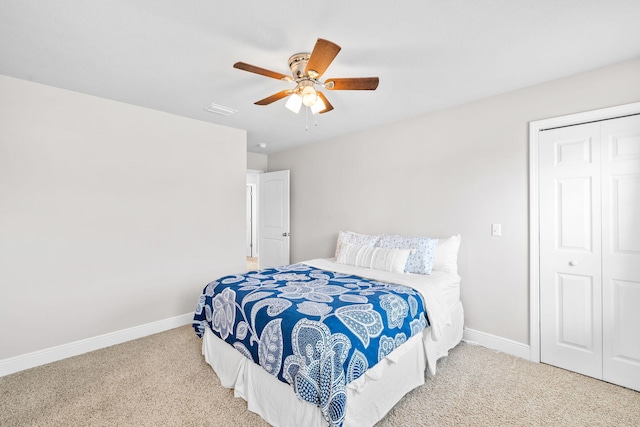 bedroom featuring carpet flooring, baseboards, a closet, and ceiling fan