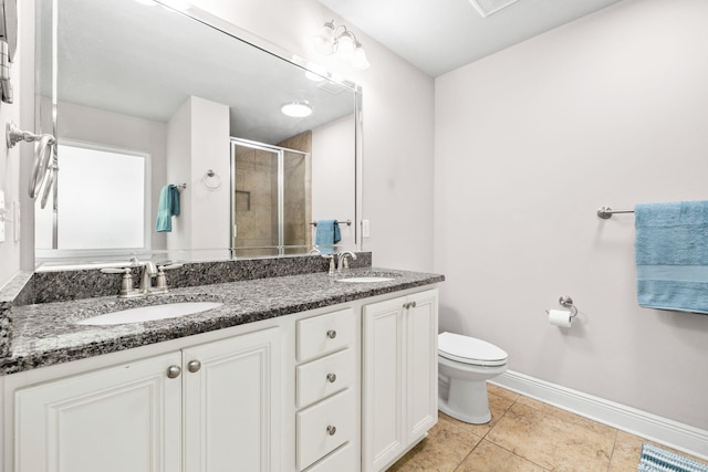 bathroom featuring a sink, visible vents, toilet, and a shower stall