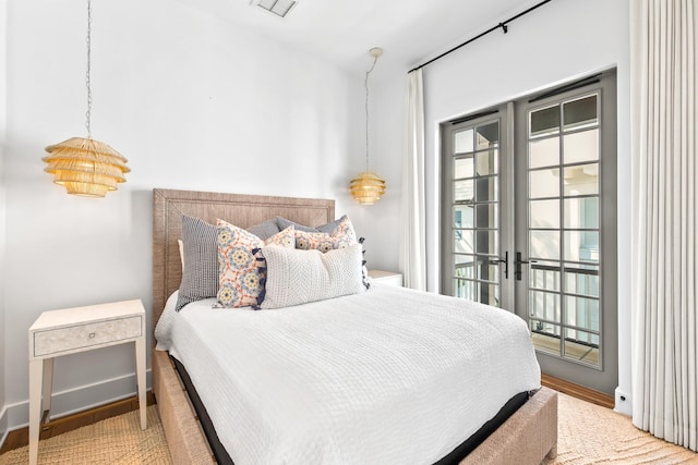 bedroom featuring french doors, baseboards, and access to outside