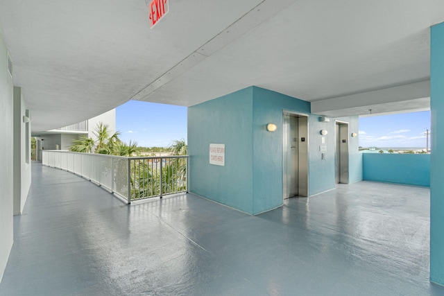 view of patio / terrace featuring a balcony and elevator