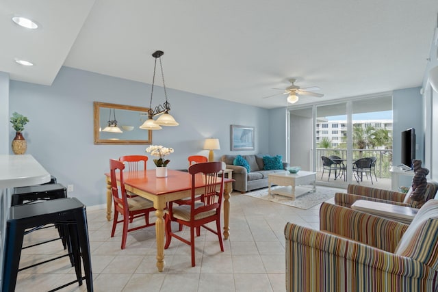 dining space featuring floor to ceiling windows, recessed lighting, light tile patterned floors, baseboards, and ceiling fan