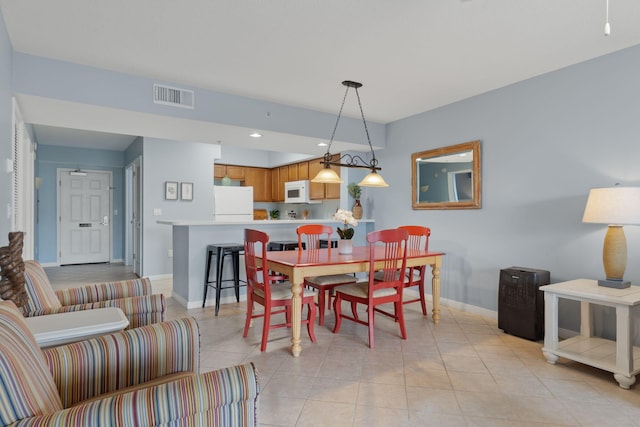 dining space featuring light tile patterned floors, visible vents, baseboards, and recessed lighting