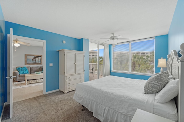 bedroom featuring access to exterior, a ceiling fan, baseboards, and light carpet