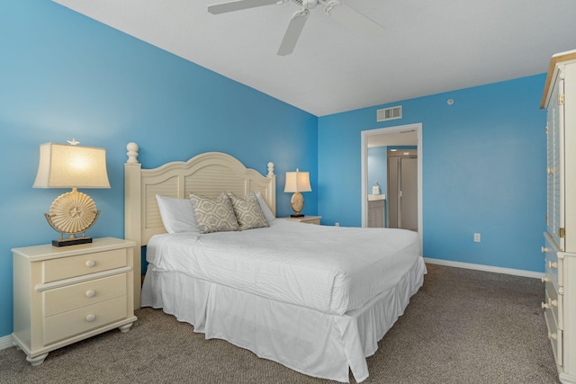 carpeted bedroom featuring visible vents, connected bathroom, a ceiling fan, and baseboards