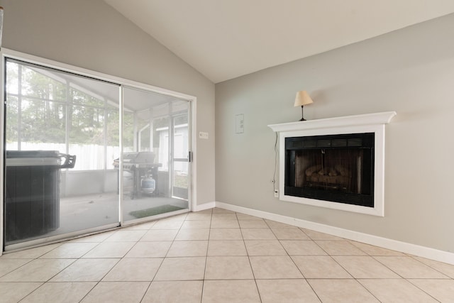 1634 N Campbell Dr, Fort Walton Beach, FL 32547 - unfurnished living room with tile patterned floors, baseboards, a fireplace, and vaulted ceiling