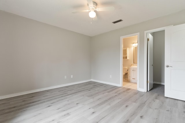 1634 N Campbell Dr, Fort Walton Beach, FL 32547 - unfurnished bedroom featuring ceiling fan, visible vents, baseboards, light wood-style floors, and ensuite bathroom