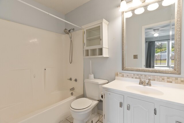 1634 N Campbell Dr, Fort Walton Beach, FL 32547 - full bathroom with ceiling fan, vanity, toilet, shower / bathing tub combination, and tasteful backsplash
