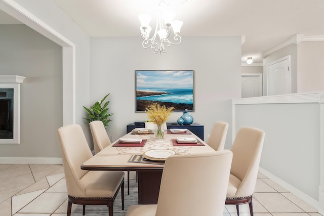 1634 N Campbell Dr, Fort Walton Beach, FL 32547 - dining area featuring light tile patterned floors, baseboards, and a chandelier