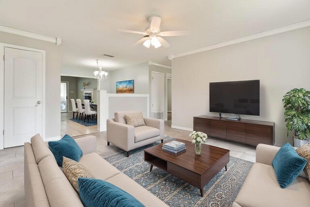 1634 N Campbell Dr, Fort Walton Beach, FL 32547 - living area featuring baseboards, ornamental molding, and ceiling fan with notable chandelier