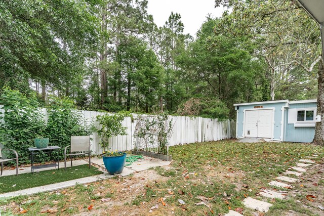 1634 N Campbell Dr, Fort Walton Beach, FL 32547 - view of yard with a fenced backyard, an outbuilding, and a storage shed