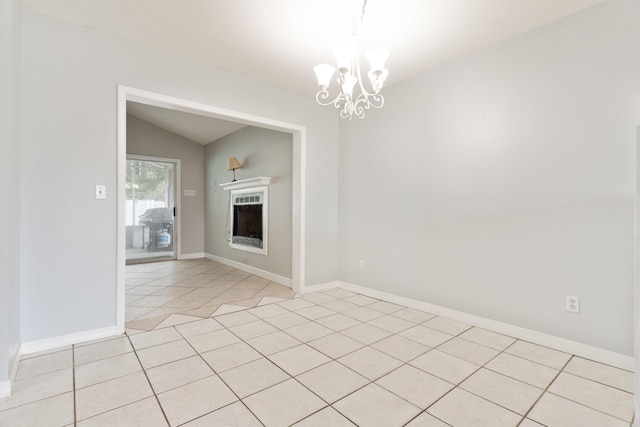 1634 N Campbell Dr, Fort Walton Beach, FL 32547 - interior space featuring an inviting chandelier, light tile patterned flooring, a fireplace, baseboards, and vaulted ceiling