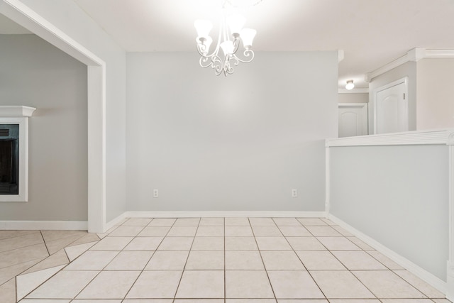 1634 N Campbell Dr, Fort Walton Beach, FL 32547 - unfurnished dining area featuring an inviting chandelier, baseboards, light tile patterned floors, and a fireplace