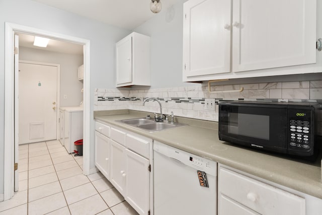 1634 N Campbell Dr, Fort Walton Beach, FL 32547 - kitchen with black microwave, dishwasher, light tile patterned floors, a sink, and washer and clothes dryer