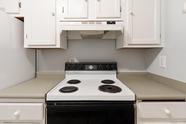 1634 N Campbell Dr, Fort Walton Beach, FL 32547 - kitchen with light countertops, electric range oven, under cabinet range hood, and white cabinets