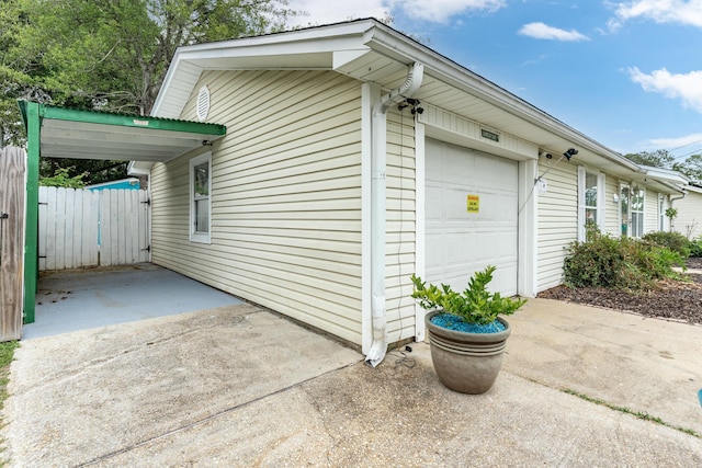 1634 N Campbell Dr, Fort Walton Beach, FL 32547 - exterior space featuring an attached garage, fence, and driveway