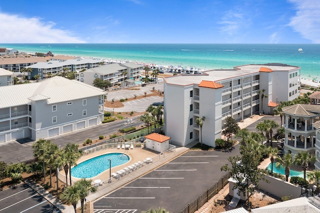 birds eye view of property with a beach view and a water view