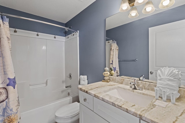 full bath with vanity, toilet, shower / tub combo with curtain, and a textured ceiling