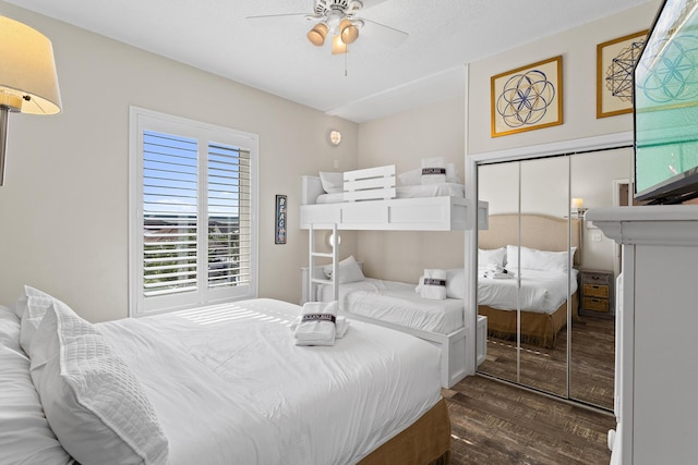 bedroom with a closet, ceiling fan, and wood finished floors