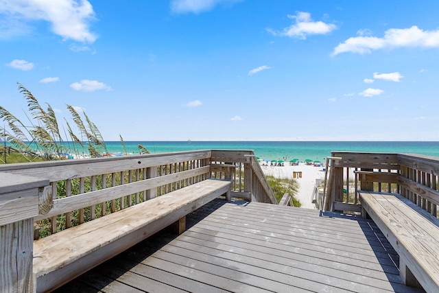 exterior space featuring a beach view and a water view