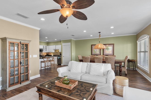 living room featuring recessed lighting, visible vents, dark wood-style floors, and crown molding