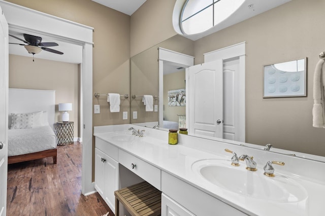 ensuite bathroom featuring ensuite bath, double vanity, and a sink