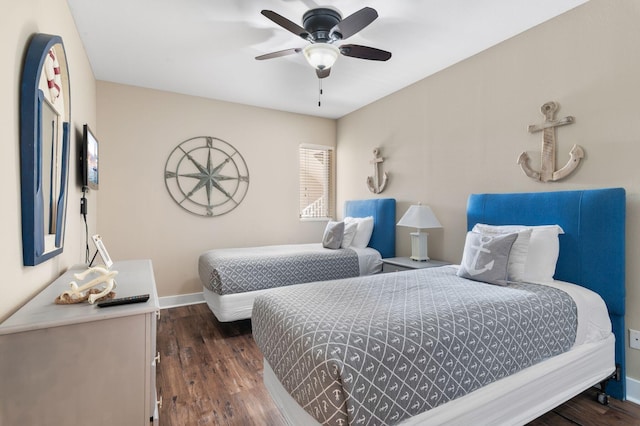 bedroom featuring dark wood finished floors, ceiling fan, and baseboards