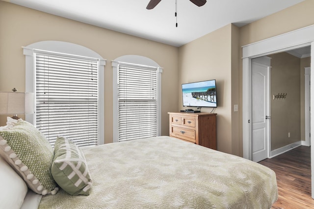 bedroom featuring a ceiling fan and wood finished floors