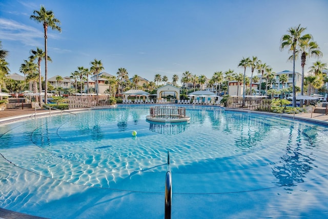 community pool with a residential view