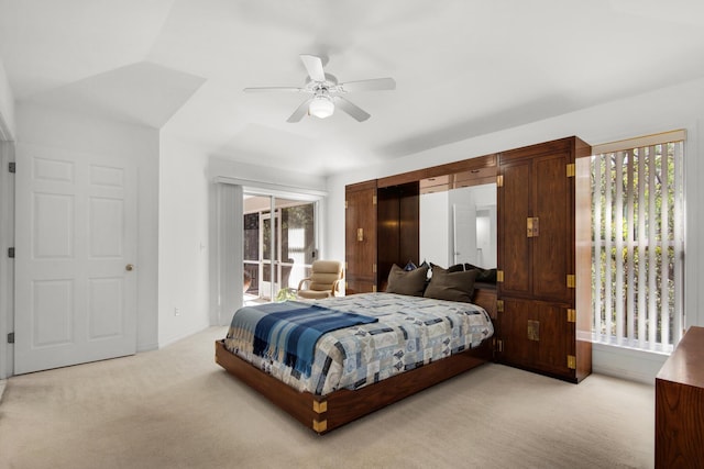 bedroom with light carpet, ceiling fan, and access to exterior