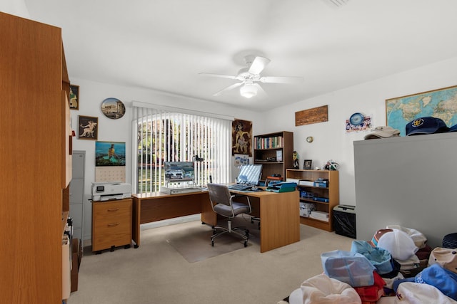 office featuring light carpet and ceiling fan