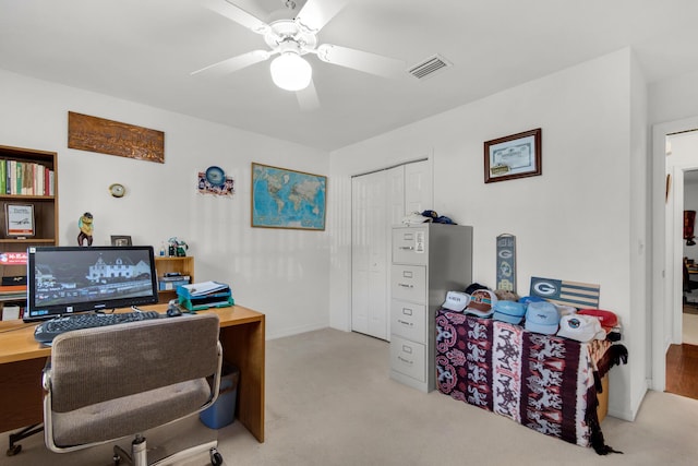 office area featuring visible vents, carpet, and ceiling fan