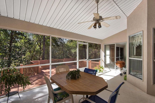 sunroom / solarium featuring wooden ceiling, a ceiling fan, and lofted ceiling