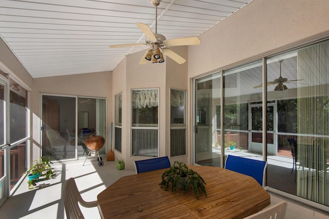 sunroom / solarium featuring lofted ceiling and a ceiling fan