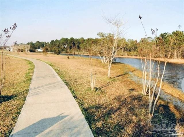 1607 Woodlawn Way, Gulf Breeze, FL 32563 - surrounding community with a water view and a yard