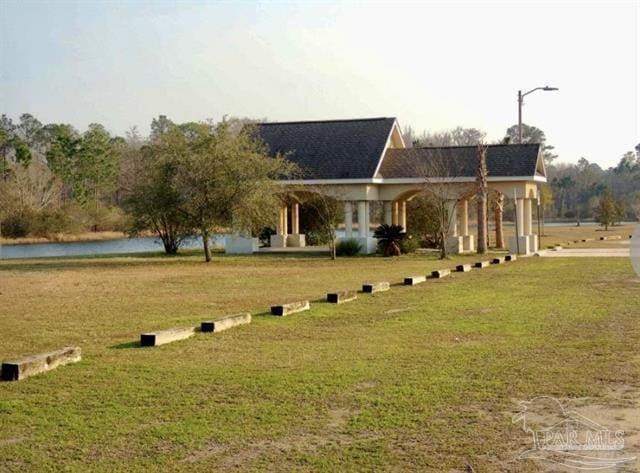 1607 Woodlawn Way, Gulf Breeze, FL 32563 - view of property's community featuring a yard and a water view