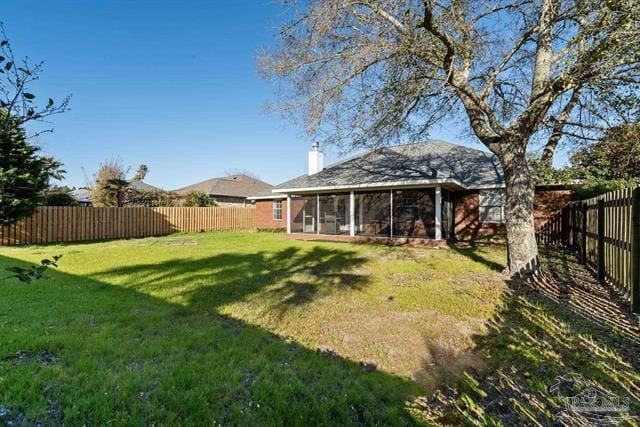 1607 Woodlawn Way, Gulf Breeze, FL 32563 - fenced backyard with a sunroom