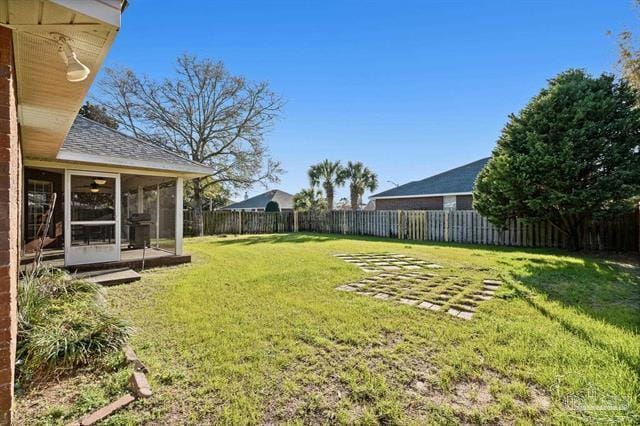 1607 Woodlawn Way, Gulf Breeze, FL 32563 - fenced backyard featuring a sunroom