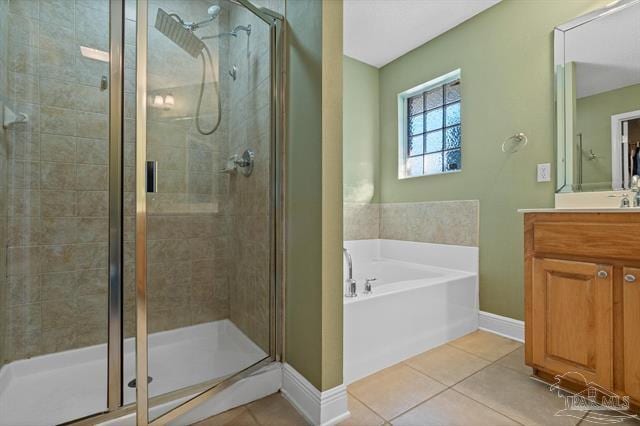 1607 Woodlawn Way, Gulf Breeze, FL 32563 - full bathroom featuring a garden tub, a stall shower, tile patterned flooring, and vanity