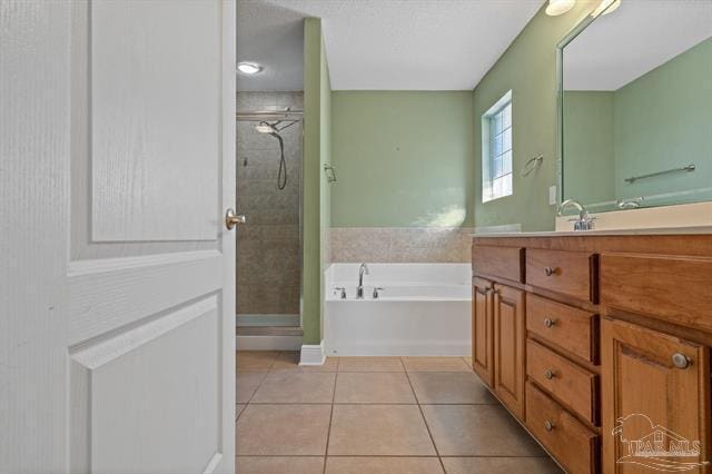 1607 Woodlawn Way, Gulf Breeze, FL 32563 - full bathroom featuring tile patterned flooring, vanity, a stall shower, and a bath