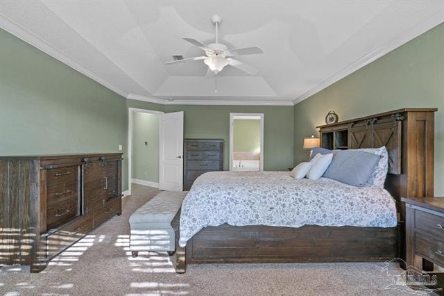 1607 Woodlawn Way, Gulf Breeze, FL 32563 - bedroom featuring a tray ceiling, ornamental molding, and carpet