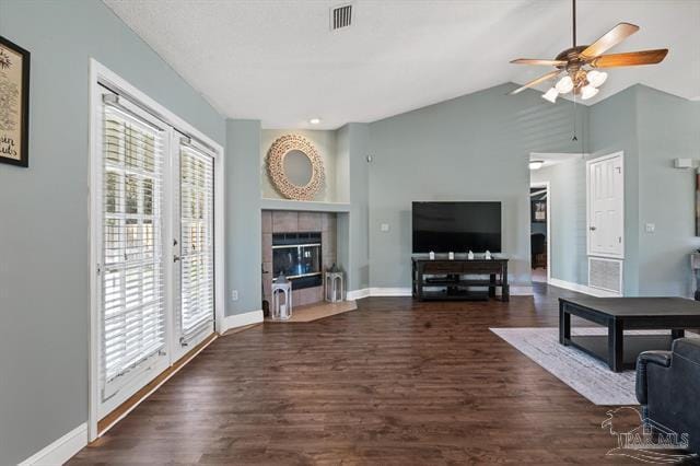 1607 Woodlawn Way, Gulf Breeze, FL 32563 - living room featuring ceiling fan, a tile fireplace, wood finished floors, and vaulted ceiling